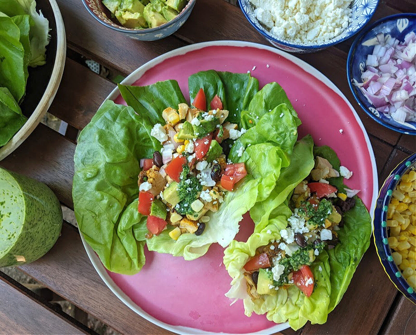 Chicken taco lettuce cups are a hand-held take on the popular Mexican 7- layer dip served at parties.